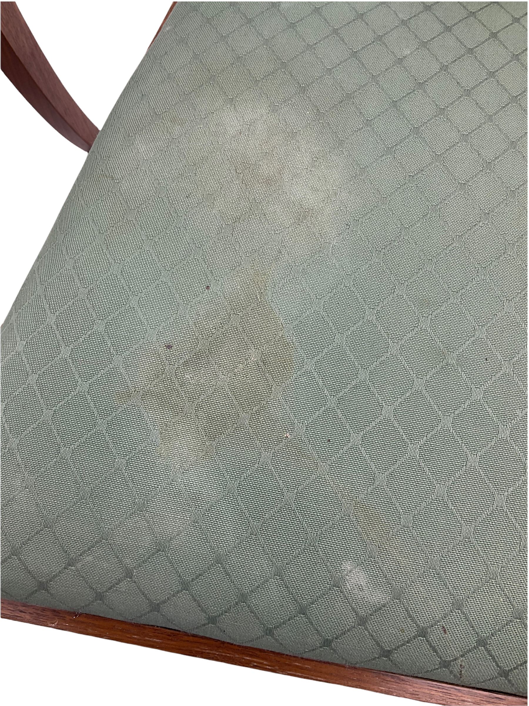 Set of eight contemporary walnut dining chairs, curved backs set with shaped splats with pierced detail, drop in upholstered seat cushions, on turned supports 