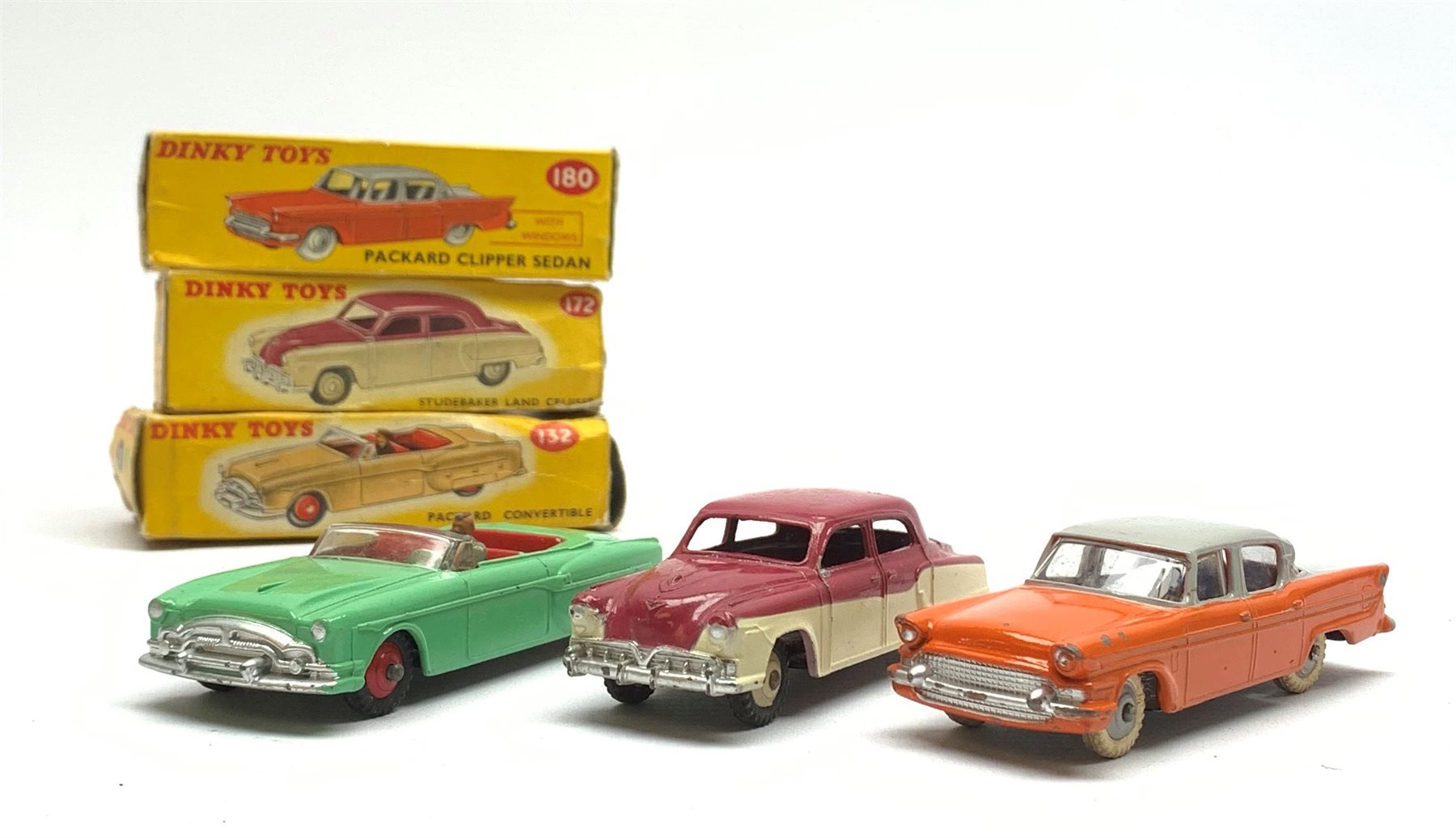 Dinky - Packard Convertible No.132, Packard Clipper Sedan with windows No.180 and Studebaker Land Cruiser No.172, all boxed (3)