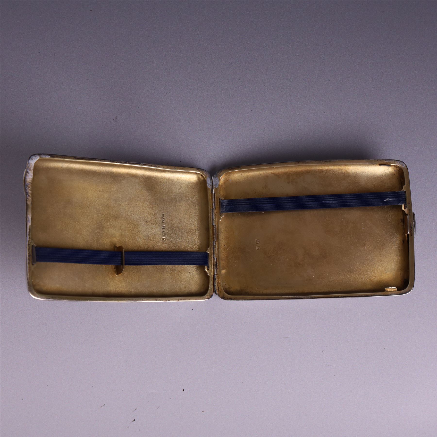 1930s silver cigarette case, of curved rectangular form with engine turned decoration and vacant cartouche, hallmarked Joseph Gloster Ltd, Birmingham 1934 and a 1930s silver sweetheart compact with engine turned decoration and enamel Royal Engineers crest, hallmarked Crisford & Norris Ltd, Birmingham 1939, cigarette box L12cm, H8cm