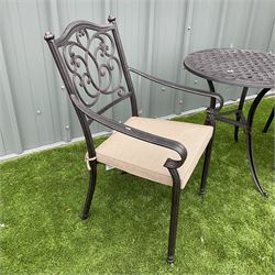 Cast metal garden table and two chairs - THIS LOT IS TO BE COLLECTED BY APPOINTMENT FROM DUGGLEBY STORAGE, GREAT HILL, EASTFIELD, SCARBOROUGH, YO11 3TX