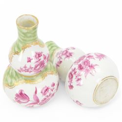 Pair of small late 19th century German double gourd vases, probably Dresden, each hand painted in puce with reserves of a courting couple within a garden setting, and floral sprays upon a white ground, within a green painterly surround, each with very faint traces of blue marks to the unglazed base, H12.5cm