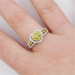 18ct white gold diamond heart cluster ring, principal heart cut fancy yellow diamond of approx 0.25 carat, surrounded by two halos of fancy yellow and white diamonds and split diamond set shoulders, Birmingham 2008, total diamond weight approx 0.50 carat
