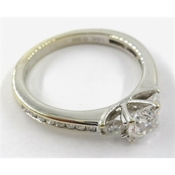  Three stone round brilliant cut diamond 18ct white gold ring, with diamond set shoulders hallmarked diamonds 0.69 carat  