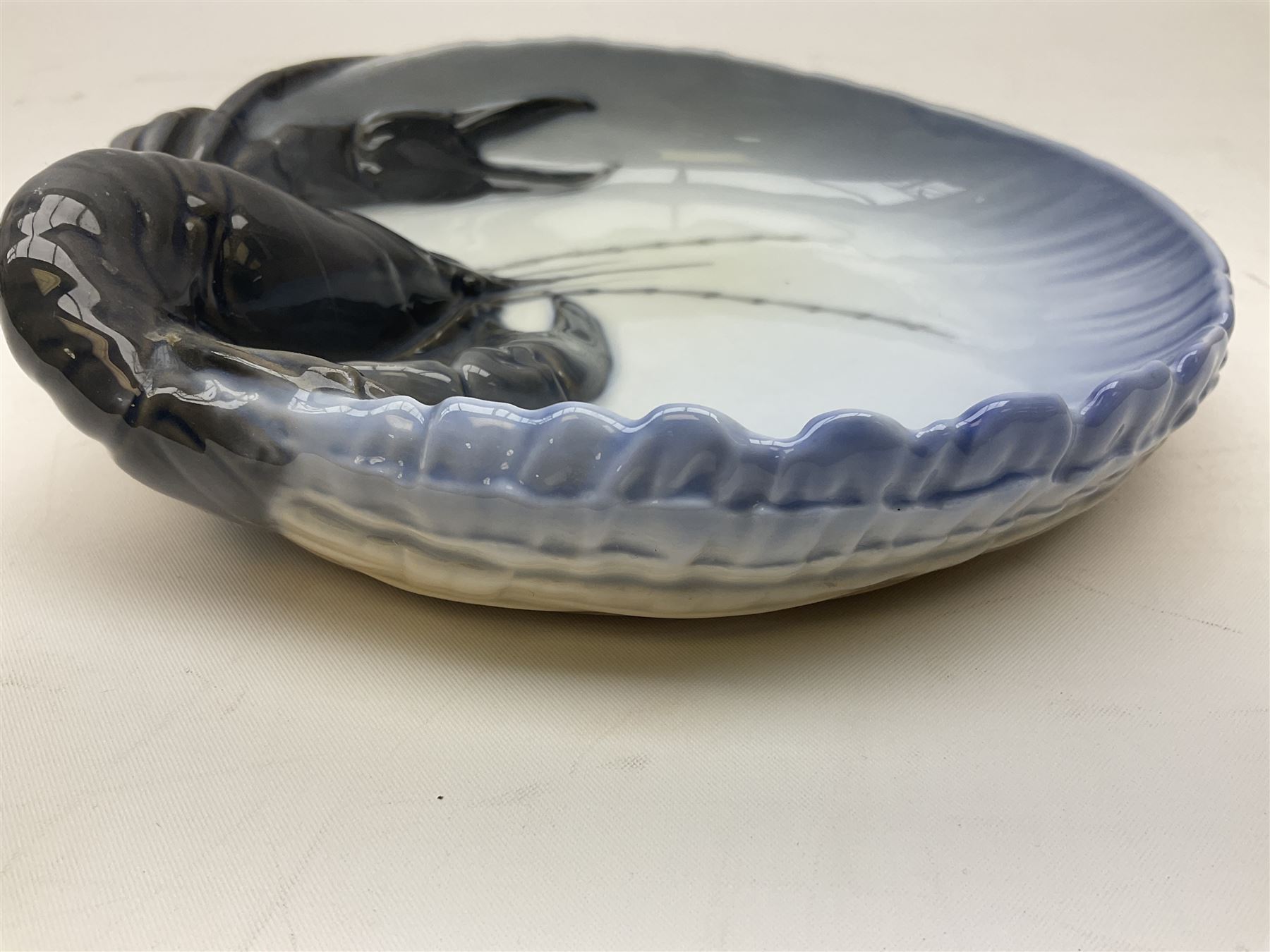 Pair of Royal Copenhagen bowls modelled as baskets and mounted with lobsters, model no 3498 and 3277, with painted and printed marks beneath, largest D19cm