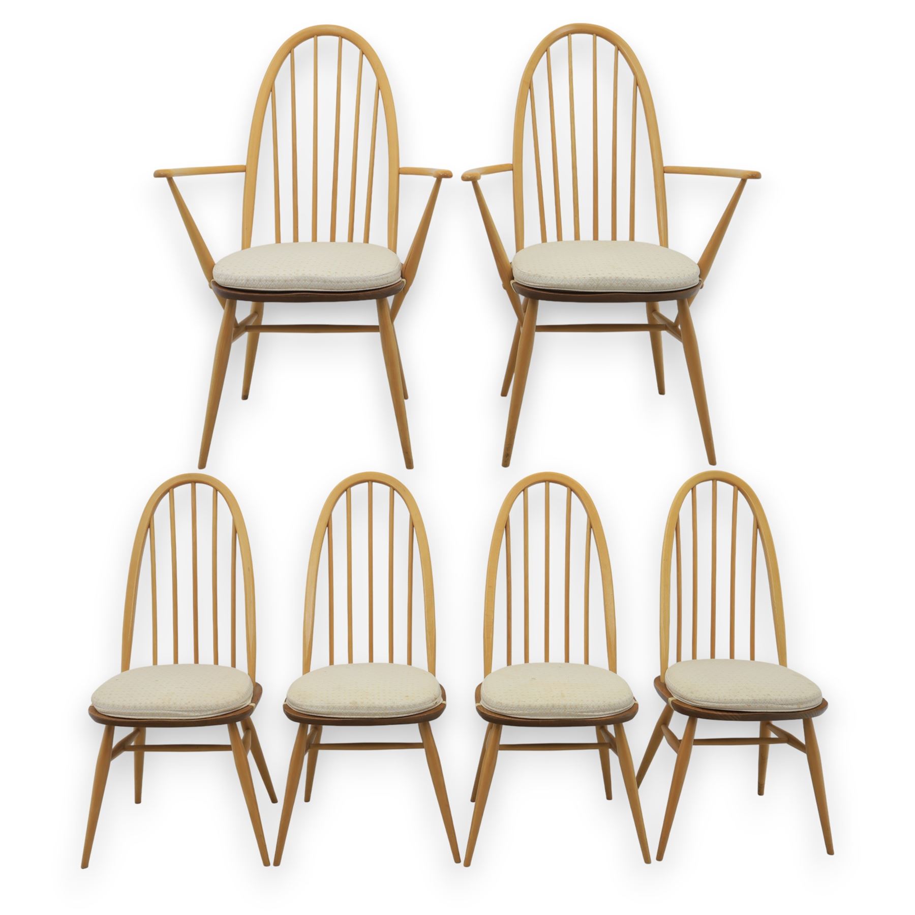 Ercol - elm dining chairs, set of six including two armchairs, arched spindle backs over shaped elm seats with upholstered pads, tapering beech legs joined by stretchers