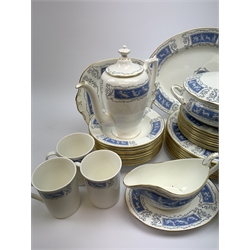 Coalport dinner and tea wares decorated in the Revelry pattern, comprising eight dinner plates, eight salad plates, six dessert plates, five side plates, ten bowls, serving dish, tureen and cover, sauce boat and stand, oval platter, coffee pot, eight tea cups and eight saucers, three coffee mugs, open sucrier, milk jug, and sandwich plate. 