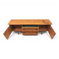 John Herbert for Youngers - 'Fonseca' mid-century teak sideboard, rectangular top above a central bank of three drawers one fitted for cutlery, flanked by cupboards with fixed shelved interior, raised on tapering supports 