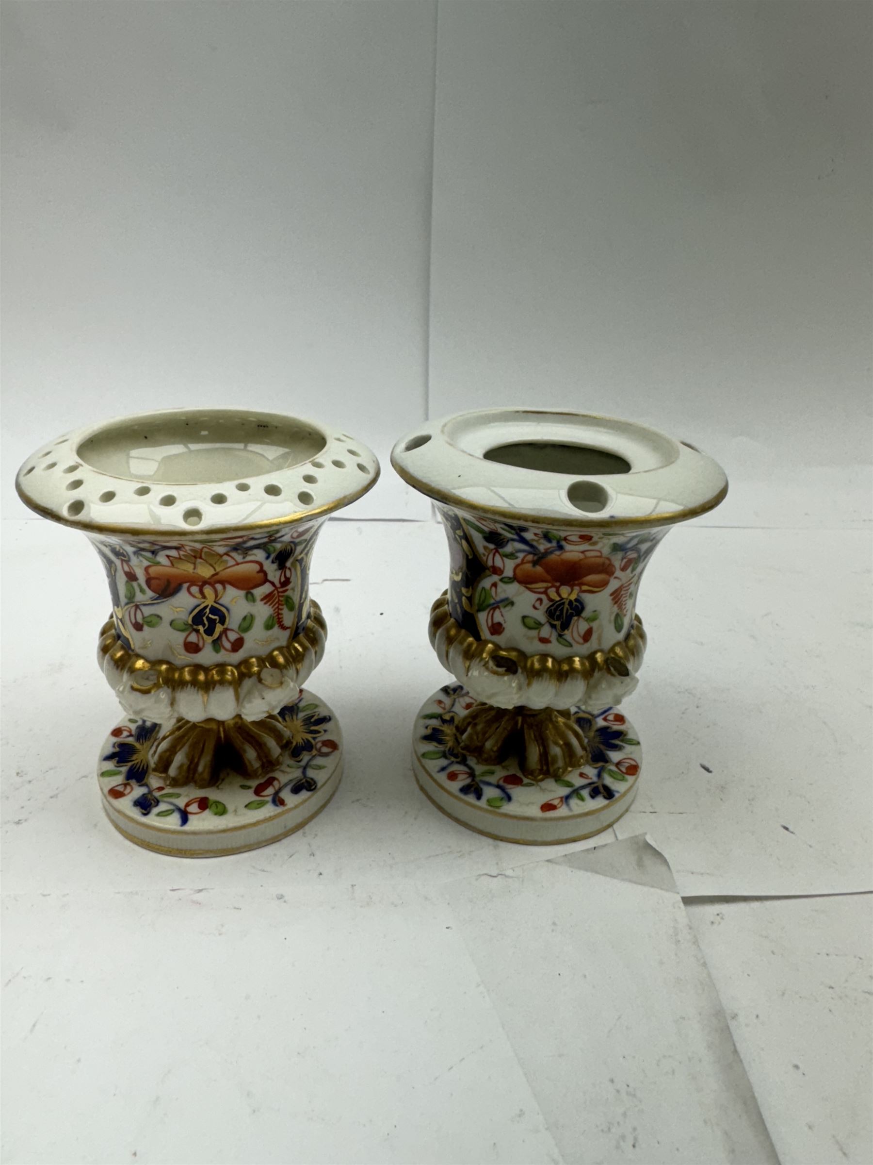 Pair of Staffordshire figures modelled as chained Dalmatians seated upon cobalt blue oval bases, H13cm, together with a Staffordshire pastille burner modelled as a castle, H12cm, a pair of 19th century Derby potpourri pots (lacking covers), and an 18th century blue and white tea bowl 