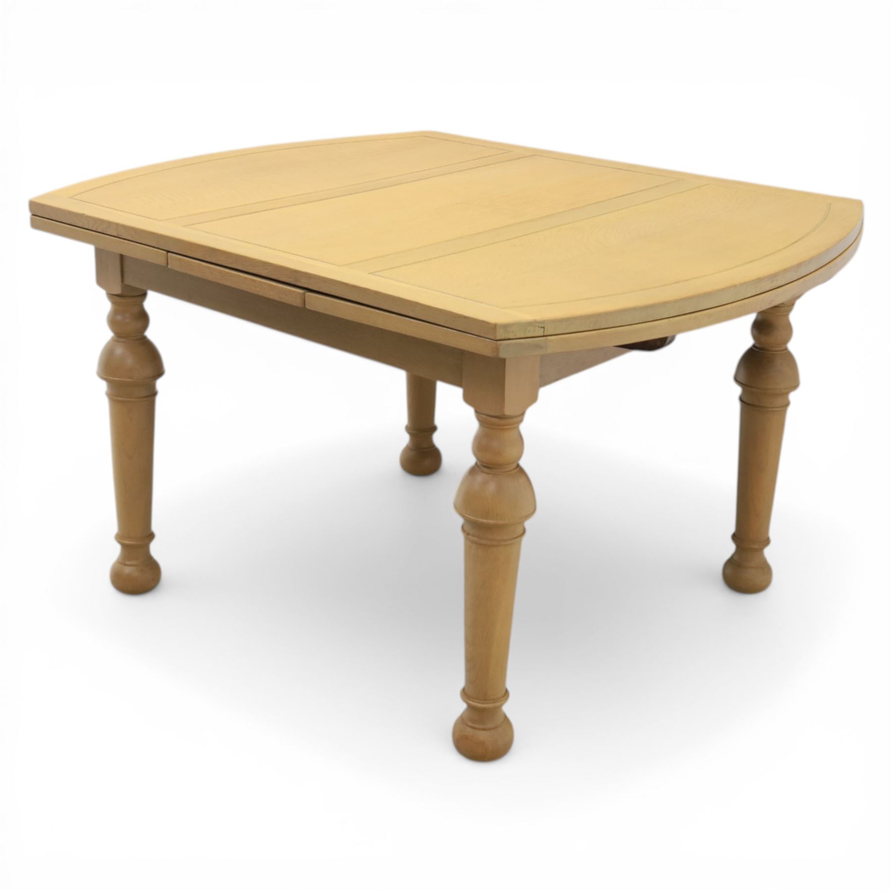 Edwardian light oak extending dining table, oval-ended rectangular top with panelled decoration and double line borders, draw-leaf extension action to 211cm long, on turned supports