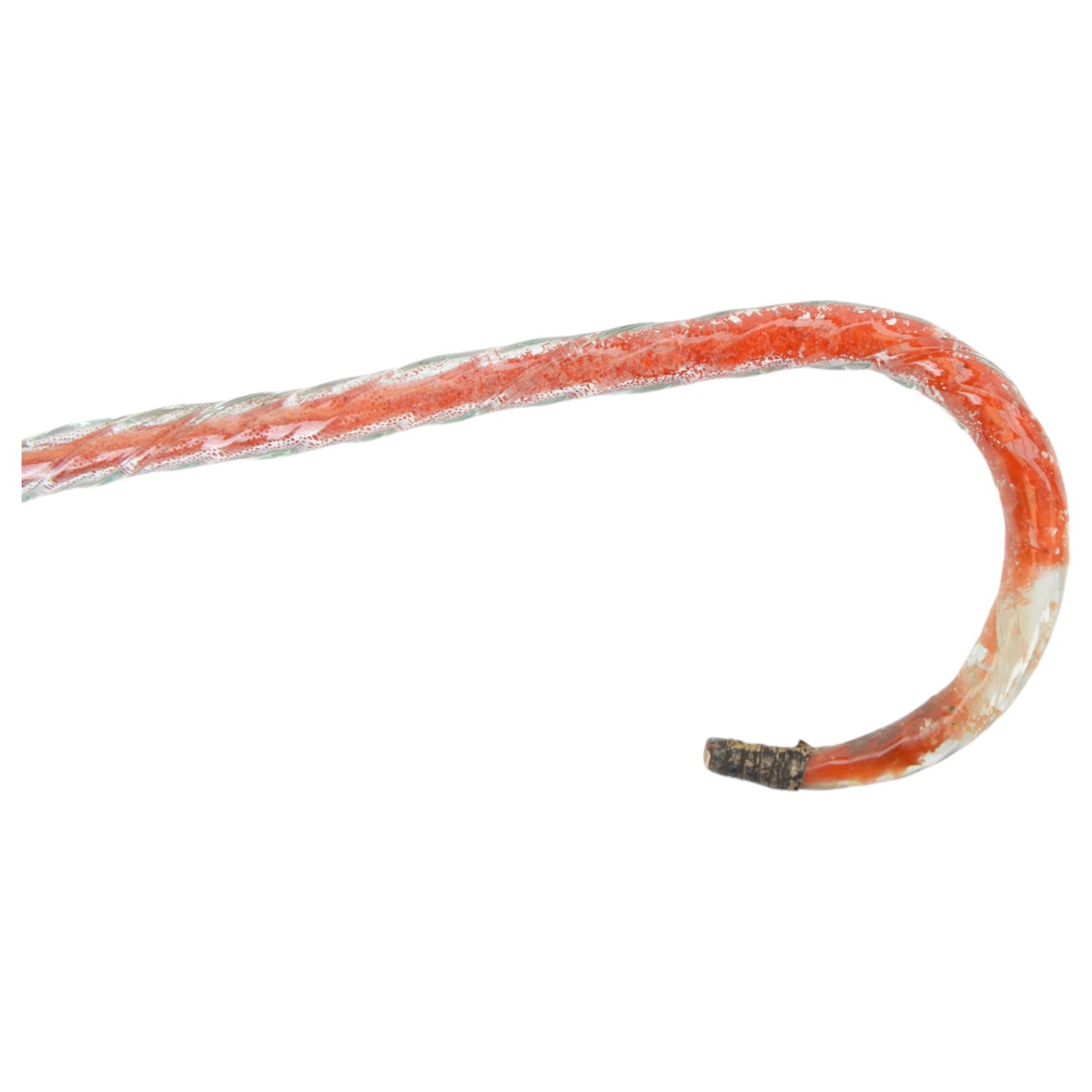 Four Victorian glass walking canes, to include two 'frigger' examples, one with blue twist design and two 'hundreds and thousands' examples, one with a knop finial and filled with micro beads, longest L105cm