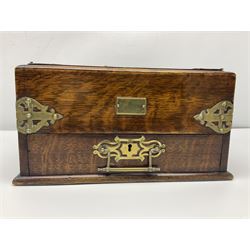 Brass mounted oak humidor, the slide action top opening to a base drawer, cedar lined with central compartment and striker, the drawer stamped Rd 107198, H17cm, D18cm