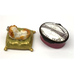 A Royal Worcester miniature model of a Spaniel dog upon a gilt cushion, c1900, with printed mark beneath, together with a Georgian enamel snuff box, detailed 'Royal Crescent A Trifle from Bath' (a/f). 