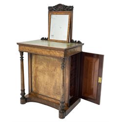 Early Victorian figured mahogany dressing cabinet, the raised shell and scroll carved back lifts to reveal rectangular easel mirror with mahogany band, flat rectangular top with tooled leather inset, slide at each side with matching leather inset, full width drawer above cupboard enclosing a series of five drawers, turned front supports, panelled front, sides and back