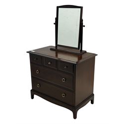 Stag Minstrel - mid-20th century mahogany dressing chest, rectangular top over three short and two long drawers, on bracket feet; matching swing mirror on turned supports