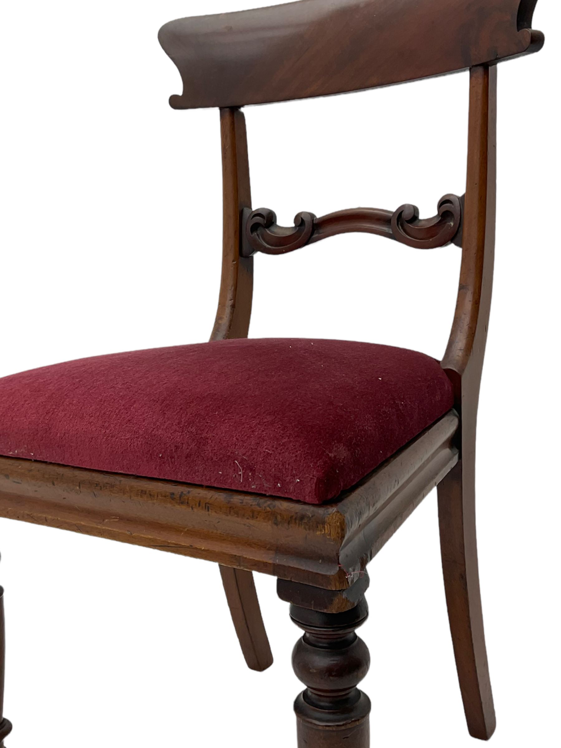 Seven early 19th century mahogany dining chairs - set six side chairs with scroll carved middle rails (W46cm), and a carver elbow chair with rope twist middle rail