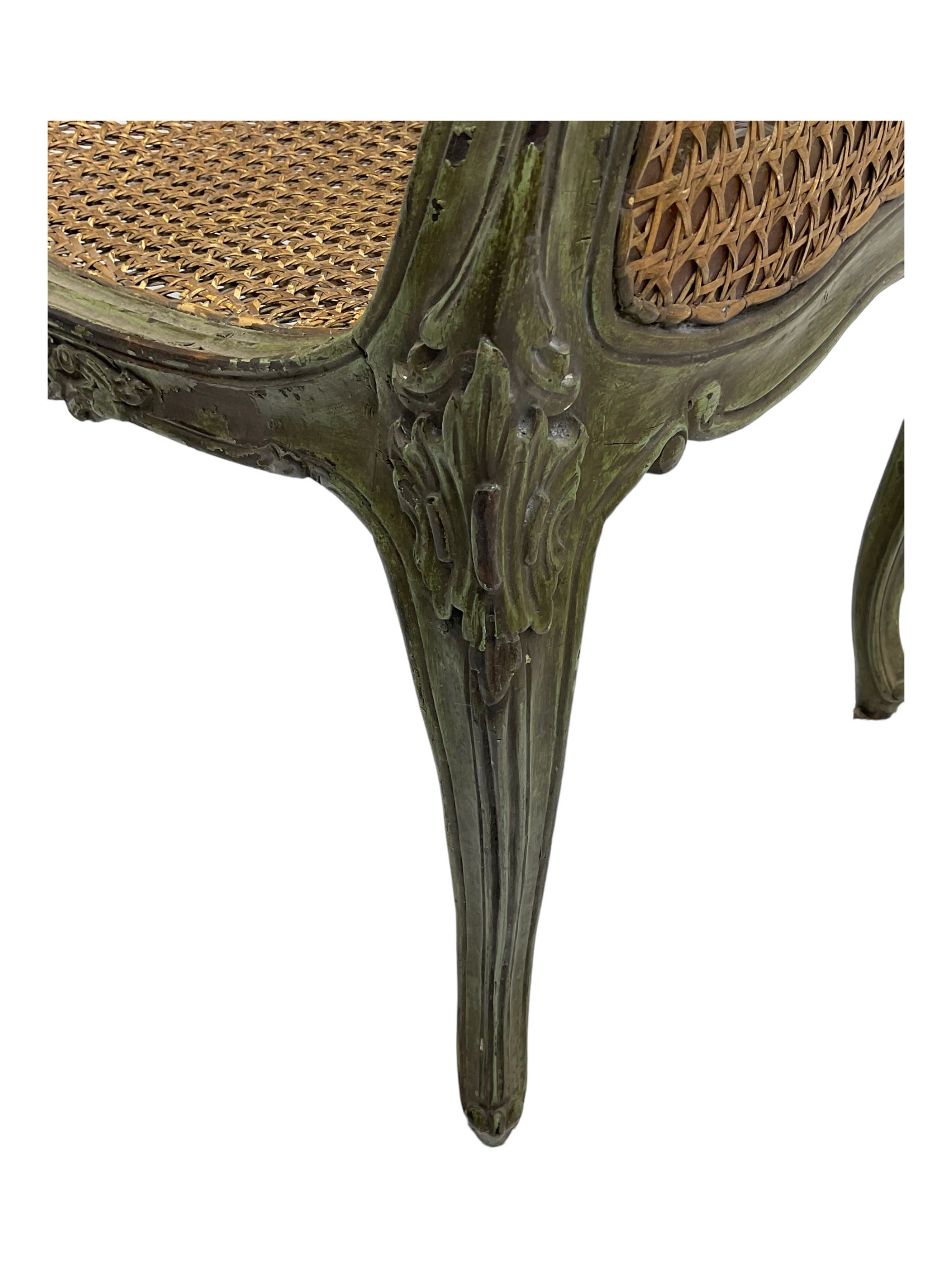 19th century French Louis XV-design armchair, carved and painted wood frame, caned back and seat with scrolled arms, supported by cabriole supports with acanthus leaf decoration