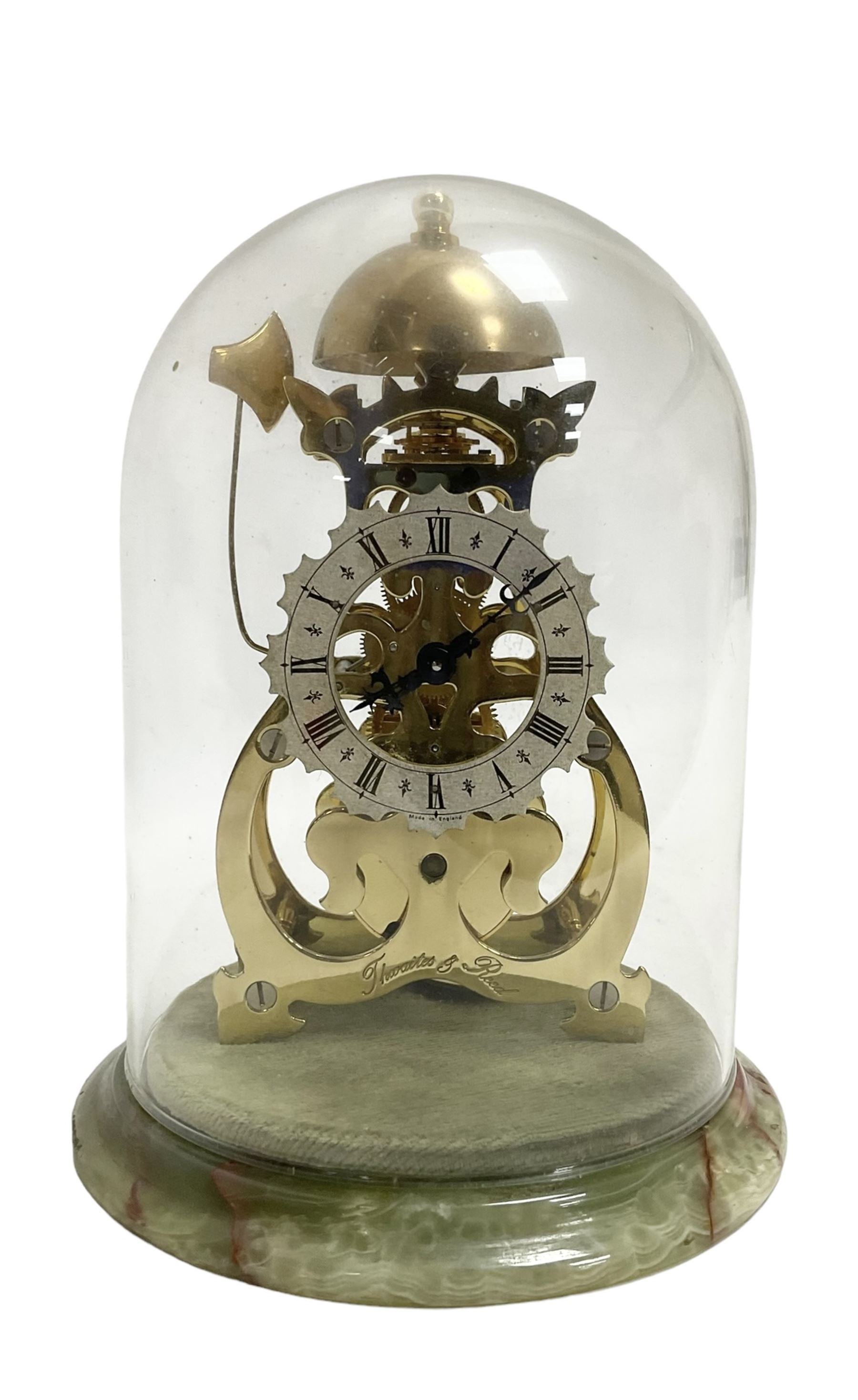 Thwaites & Reed - Small 20th century skeleton clock with a glass dome and stepped onyx base,  pierced movement frames with a silver chapter ring, Roman numerals, minute markers, and steel hands, domed brass bell with passing strike on the hour, with a lever platform escapement, wound and set from the rear. With key.