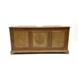 Late 20th century panelled oak blanket box, the central panel carved with the Yorkshire rose, on bracket feet