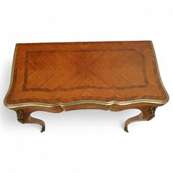 Early 20th-century Louis XV-style kingwood and tulipwood marquetry card table, shaped rectangular hinged top revealing baize-lined interior, with quarter-veneered parquetry within crossbanded borders and mounted with a gilt bronze edge, above a serpentine frieze,  raised on cabriole legs with gilt bronze foliate mounts and sabots 