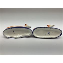 Pair of Staffordshire recumbent greyhound pen holders 