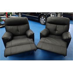Two reclining armchairs upholstered in black faux leather