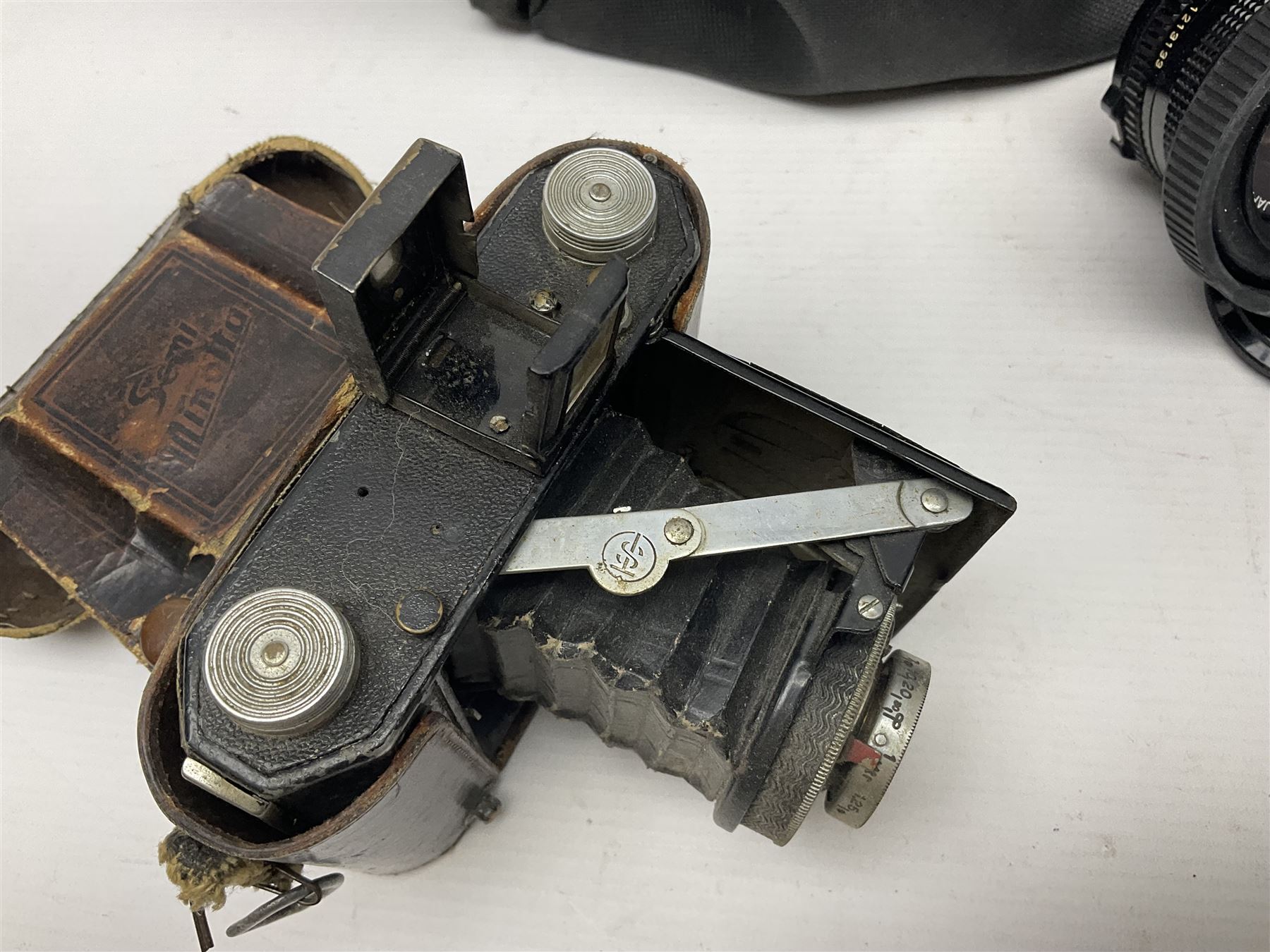 Canon A1 camera body, serial no 775843, together with 'Canon Lens FD 200mm 1:4 lens' serial no 24432, together with Semi Minolta folding camera, Canon 'Zoom FD 35-105mm 1:3.5-4.5' lens, Canon 'Macro Focusing Zoom 72mm Hanimex HMC 28-200mm' lens and other camera equipment  