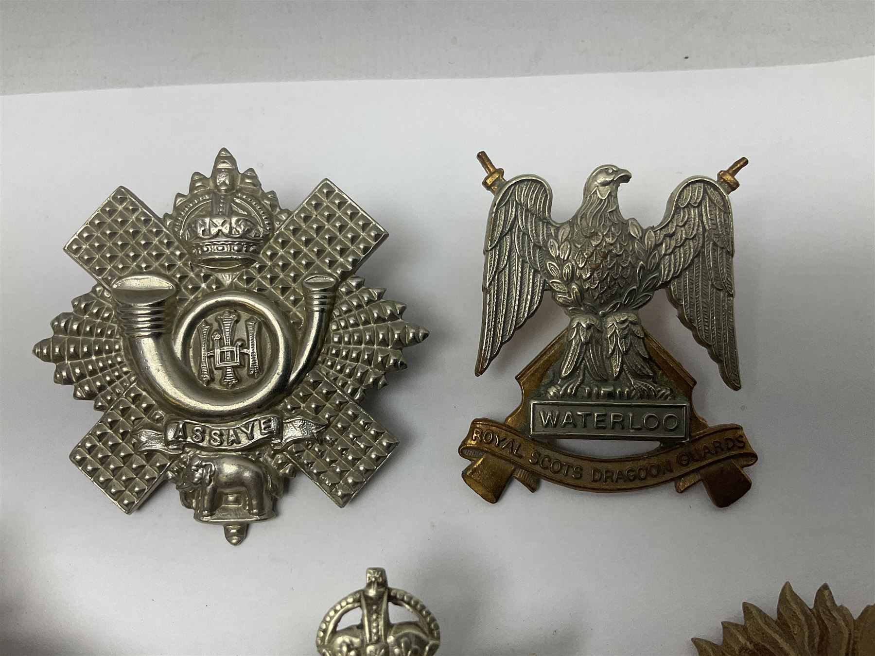 Fifteen Scottish Glengarry and other metal military badges including Argyll & Sutherland, Royal Glasgow Yeomanry, Cameronians, Lanarkshire Yeomanry, Kings Scottish Own Borderers, Highland Light Infantry, Border Regiment, Lowland Regiment, Lothians & Border Horse Yeomanry, Ayrshire Earl of Carricks Own Yeomanry etc