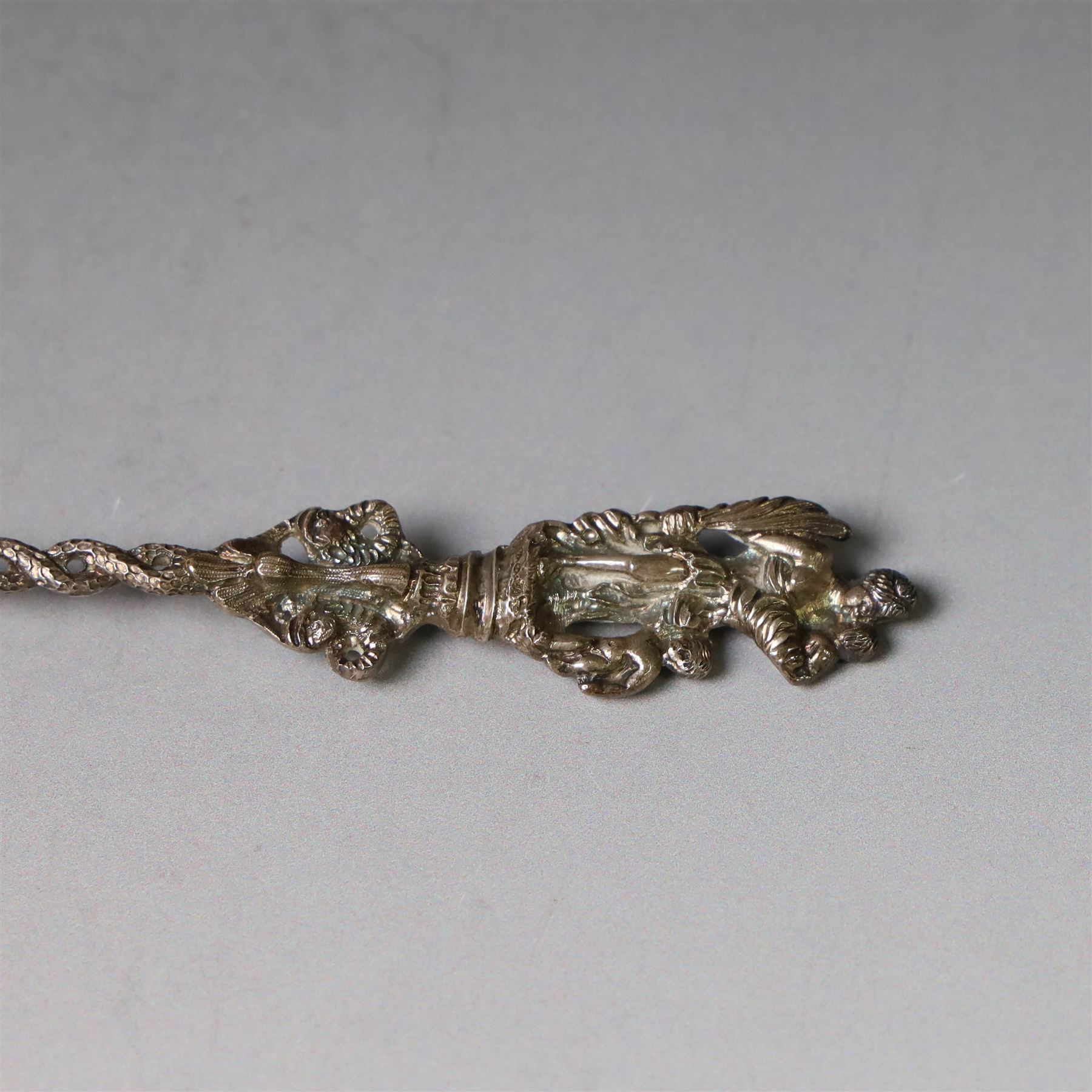 Late Victorian apostle topped sifting spoon, the finial depicting St Christopher, with entwined serpent handle and pierced gilt bowl, hallmarked Mappin & Webb, London 1890, in fitted retailers box for Catchpole and Williams Ltd