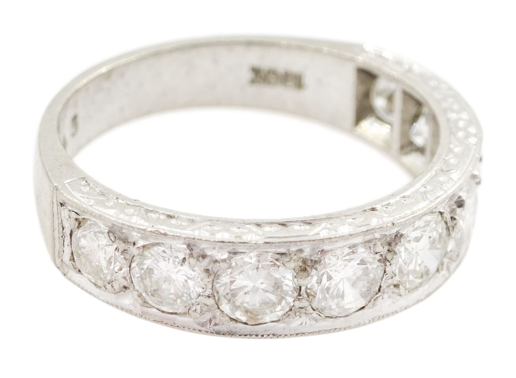 White gold seven stone round brilliant cut diamond ring, the sides with engraved decoration, stamped 18ct, total diamond weight approx 1.15 carat