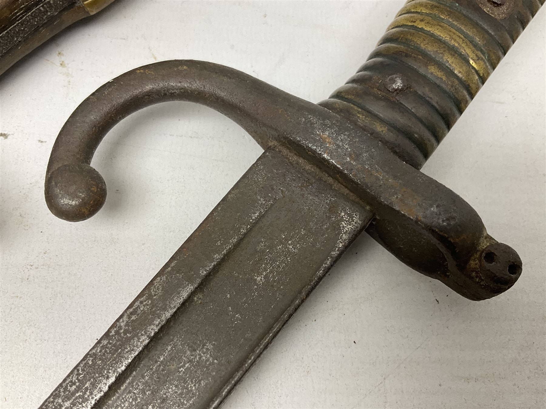 Five 19th century bayonets in relic condition without scabbards comprising British Pattern 1876 socket bayonet with Indian markings; French Model 1874 epee bayonet; and three French Model 1866 sabre bayonets (5)