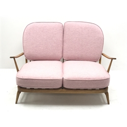 Ercol 'Windsor' beech frame two seat sofa with loose cushions upholstered in pink fabric, W134cm