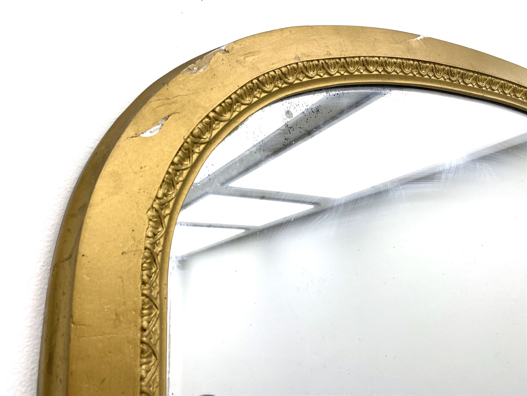 Tall Victorian hall mirror, in arched gilt frame with foliate mould slip, acanthus scroll corner brackets 