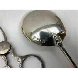 Hallmarked silver spoon, marked Pamela with the terminal in the form of a man, together with hallmarked silver sugar nips with shell bowls, pair brass candlesticks, Viner's candelabra and three other silver plated items