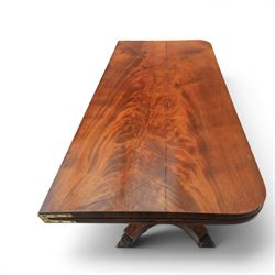 Victorian figured mahogany side table, fold-over swivel extending top, tapering square column above quatrefoil base