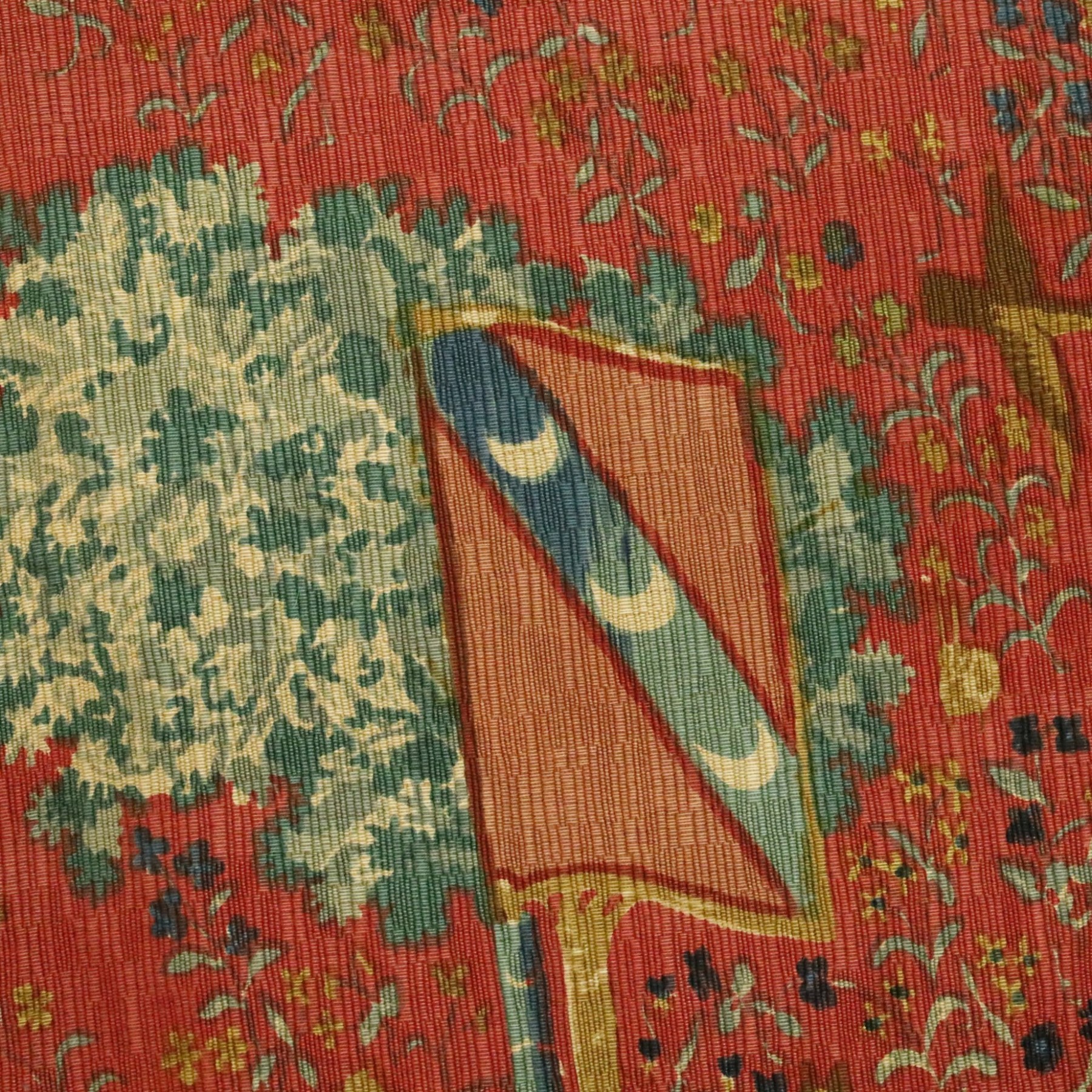 Neo-classical wall hanging, depicting women playing the harp surrounded by animals, on a red ground, with metal pole, L146cm