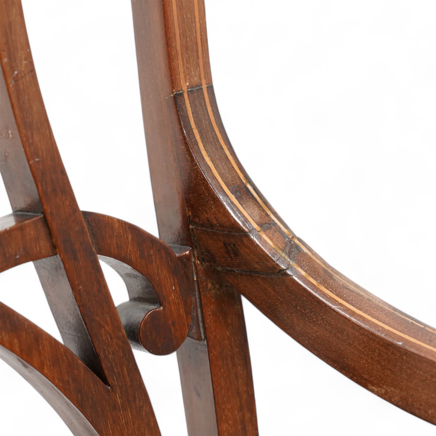 Edwardian inlaid mahogany elbow chair, satinwood banded cresting rail decorated with acanthus leaf carving, open pierced and interlaced back inlaid with curled foliage, floral pattern fabric upholstered seat, on square tapering supports with compressed spade feet