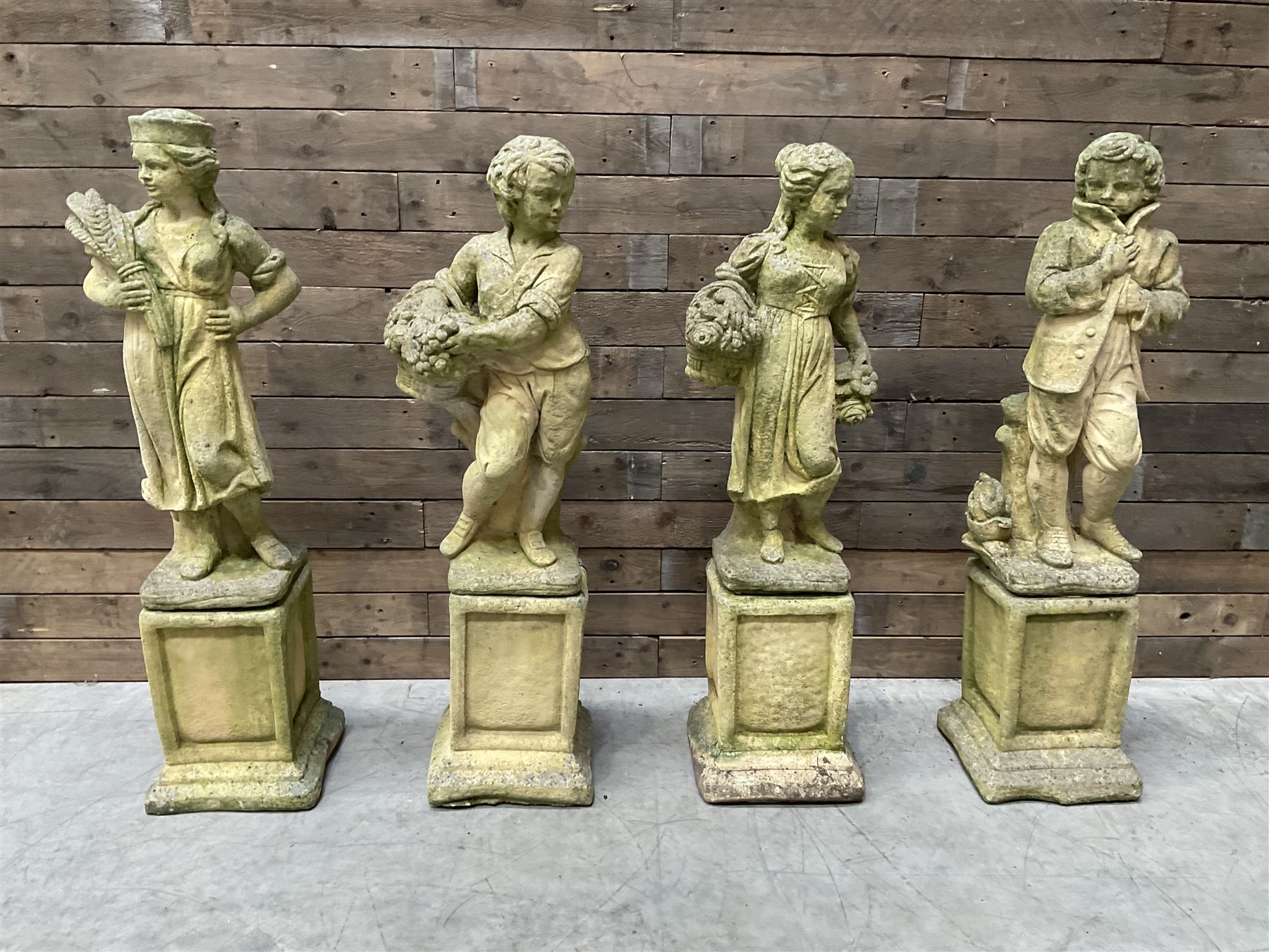 The Four Seasons - set of four cast stone garden figures on plinths