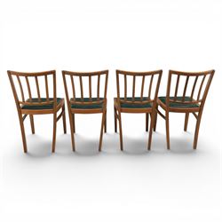 Mid 20th century teak extending dining table, together with eight teak chairs with green leather seats, extends to 154cm