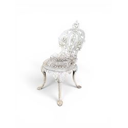 Pair of white painted cast metal garden chairs, ornate reclined backs, circular pierced seats on cabriole legs