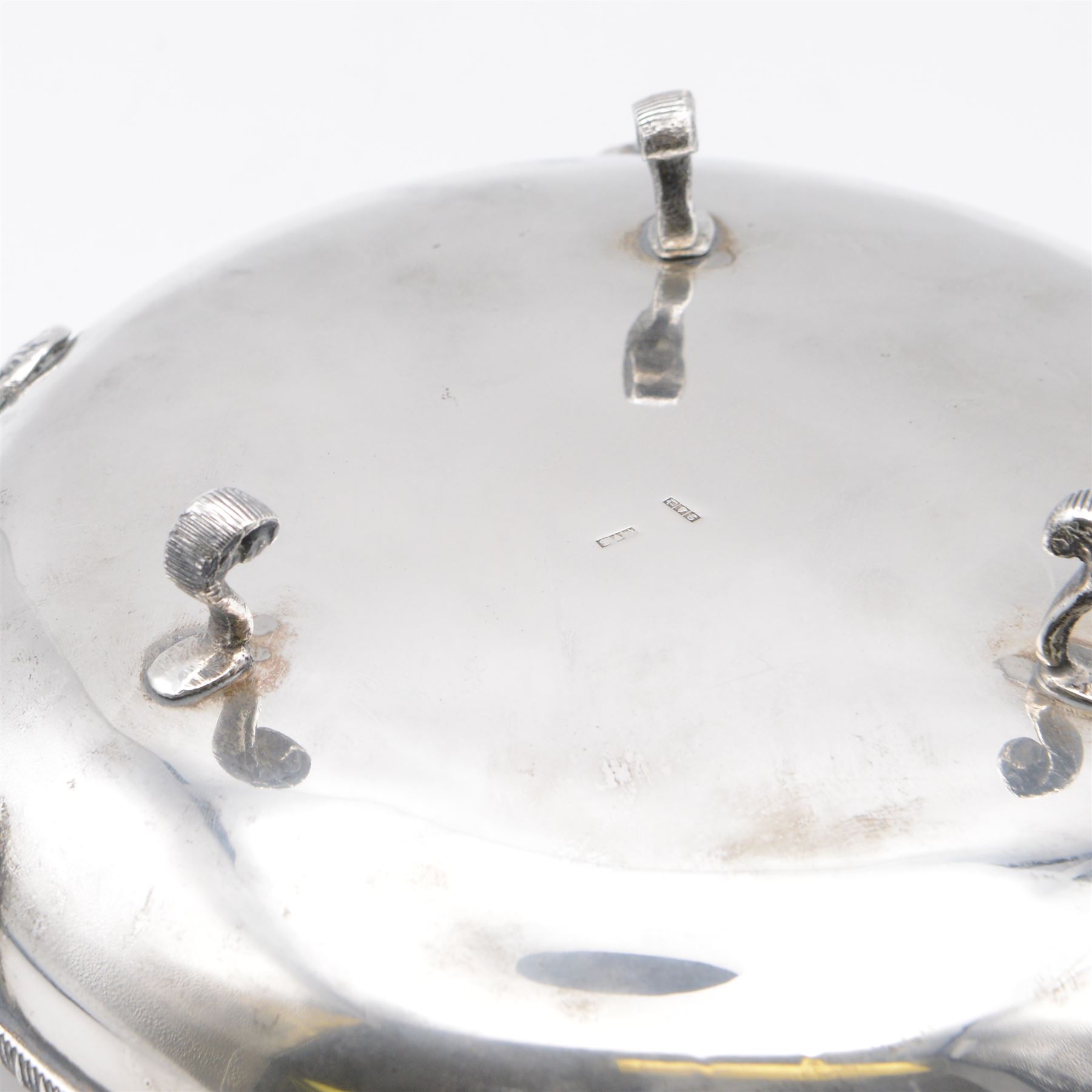 Egyptian silver bowl, of circular form, with oblique gadrooned rim and cast palmette decoration, upon three scroll feet, marked for 900 fineness, D20cm