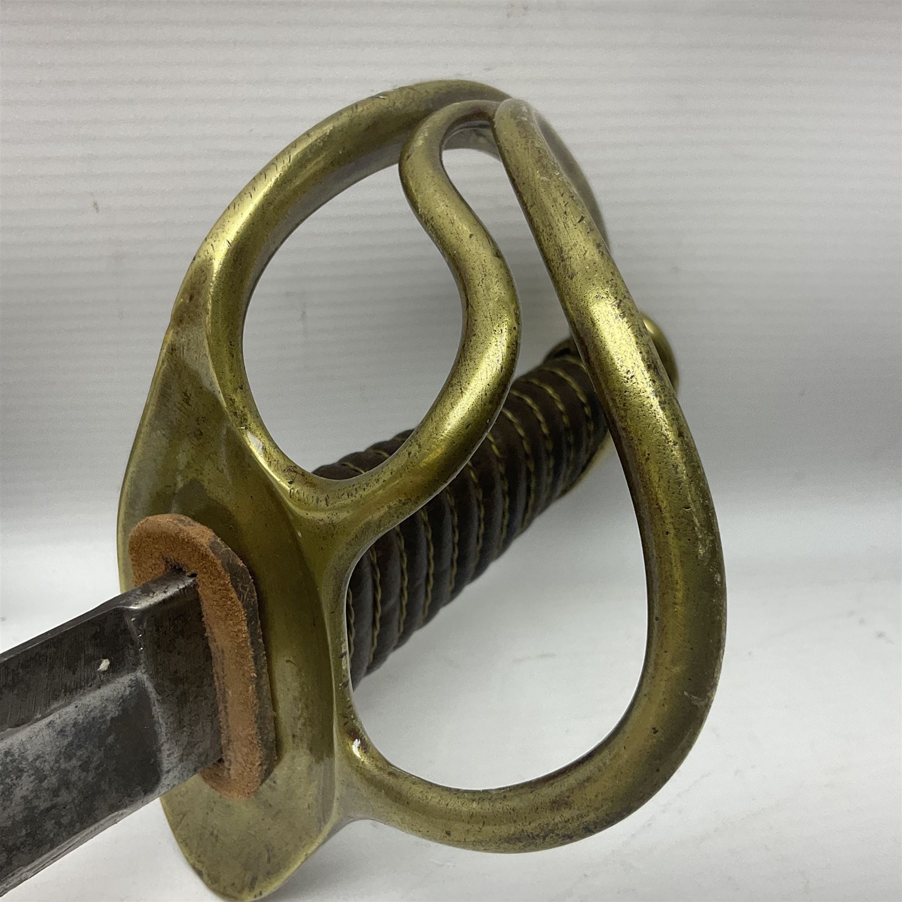 19th century French 1822 Pattern Light Cavalry trooper's sword with 88.5cm slightly curving fullered blade, brass three-bar hilt and wire-bound leather grip; in polished steel scabbard with two suspension rings L110.5cm overall