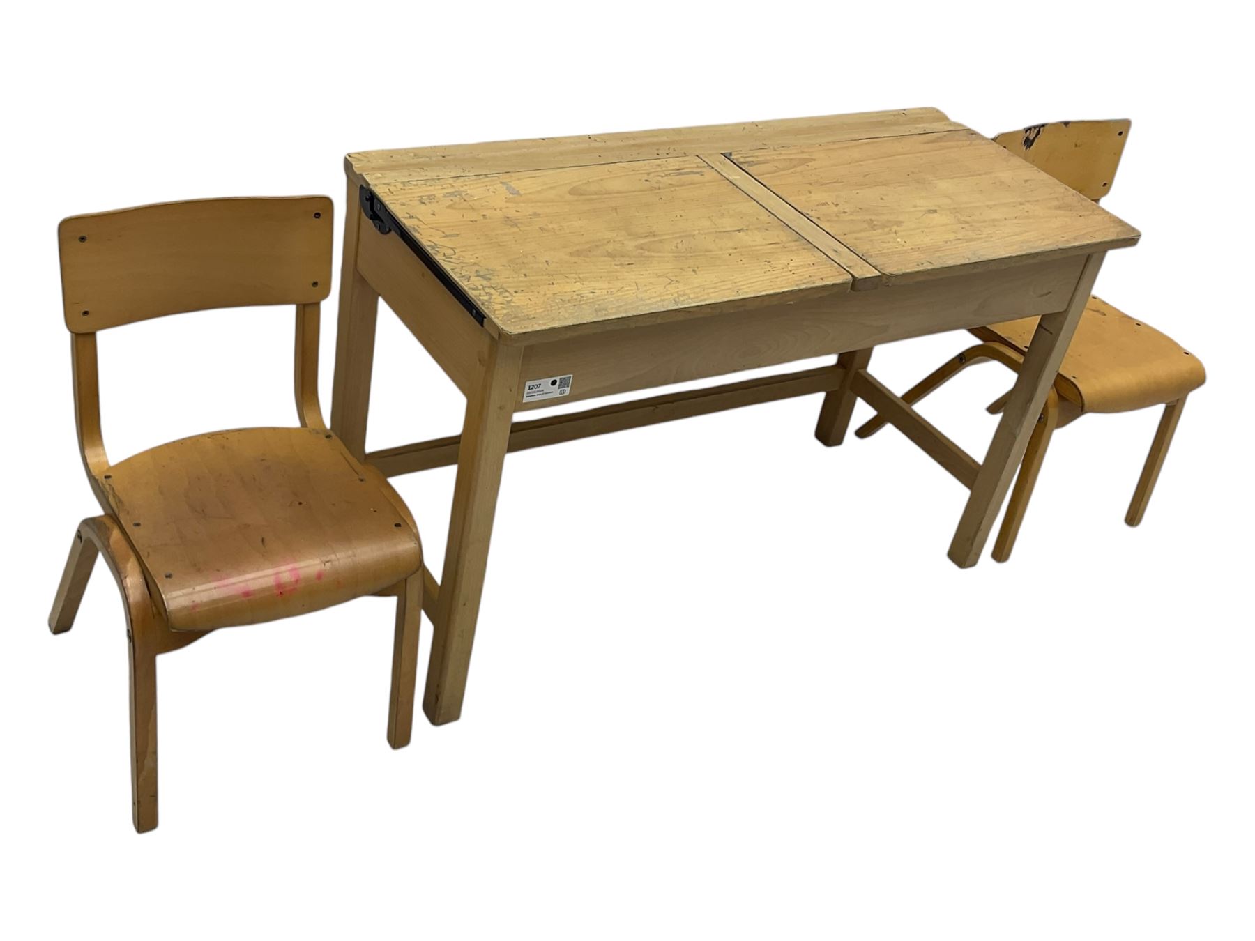 Mid-20th century beechwood school desk, rectangular lift-top desk with storage compartment, supported by square legs with cross stretchers; two matching beech chairs (3)