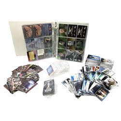 Collection of Star Trek collectors cards to include ‘Alternate Universe’ and ‘Q Continuum’ series, Star Wars cards etc housed in white album
and Harry Potter, Disney and other loose examples