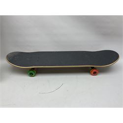 Three skateboards, including Santa Cruz example, together with a collection of wheels, including Spitfires, trucks and other accessories