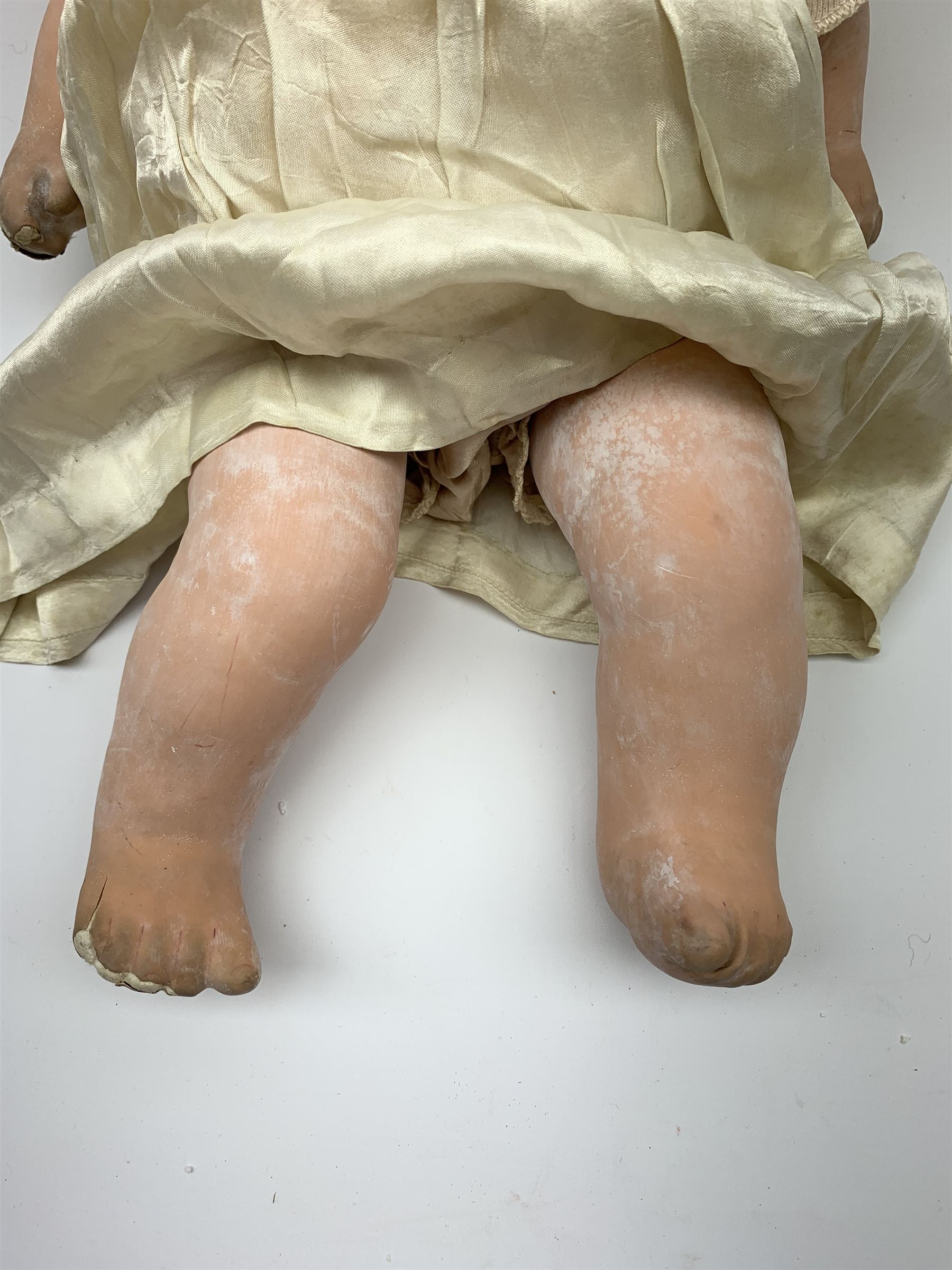 Seyfarth & Reinhardt composition head baby doll with moulded hair, sleeping flirty eyes, open mouth with one tooth and tongue and soft body with composition jointed limbs, marked 'SuR Germany 30/5' H47cm; together with a Golborne Dolls 'Golborne Beauty' composition head and body bride doll, marked 'F.P.23' in original box H63cm (2)