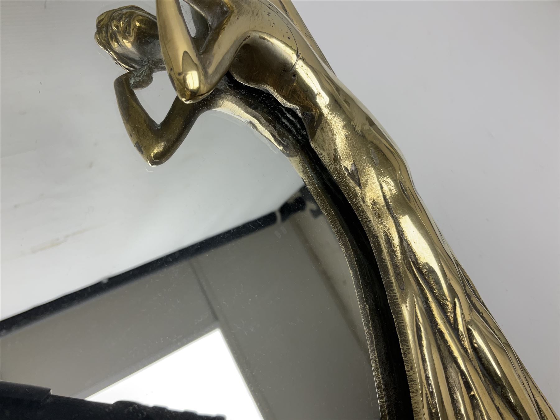 Art Nouveau style mirror in the manner of WMF, decorated with a female figure and floral motifs, the easel support verso with spurious WMF, H35cm