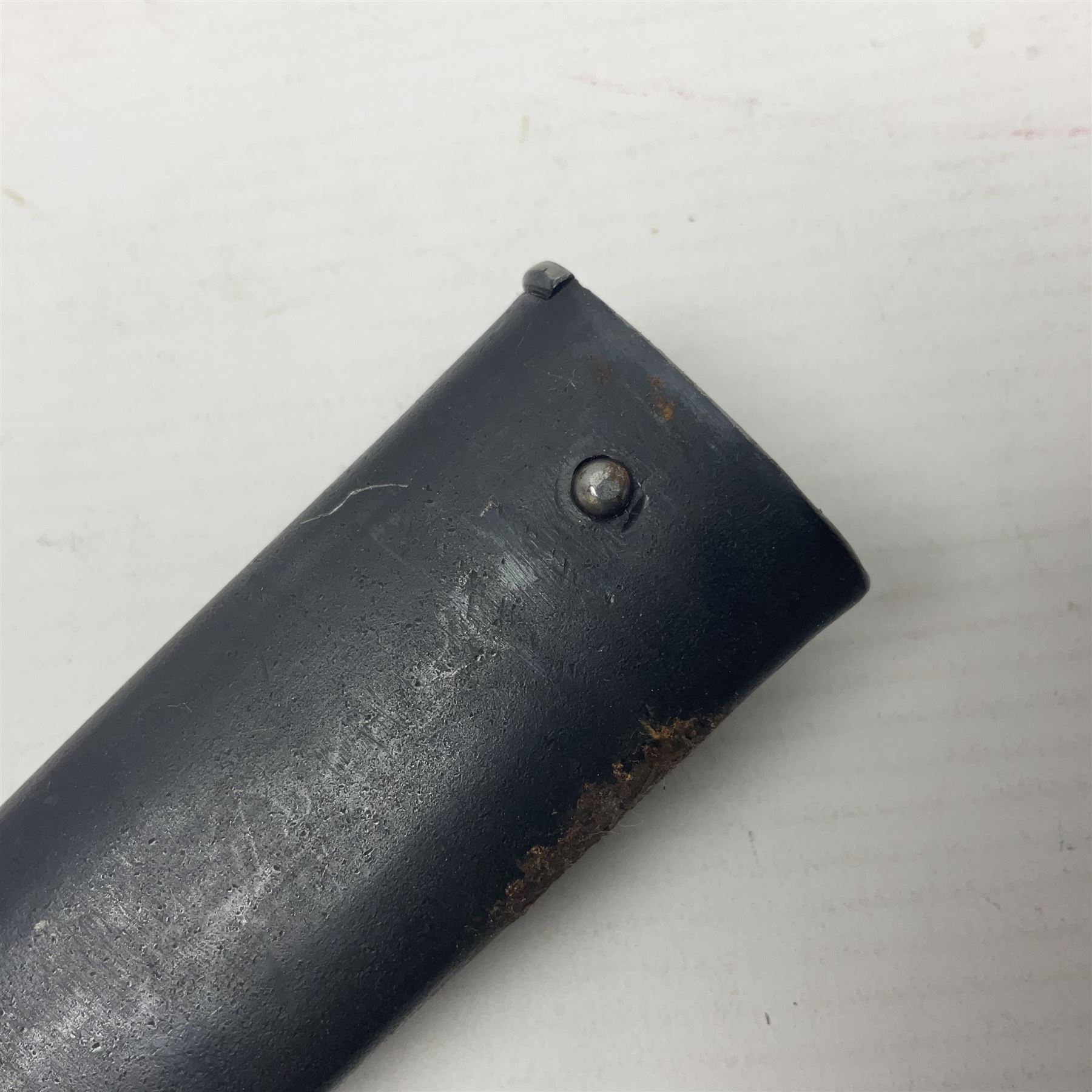 Austrian Model 1895 Carbine knife bayonet with 24.5cm fullered steel blade; various marks to the ricasso including F.G. GY.; cross-piece marked No.7843; in steel scabbard L37cm overall