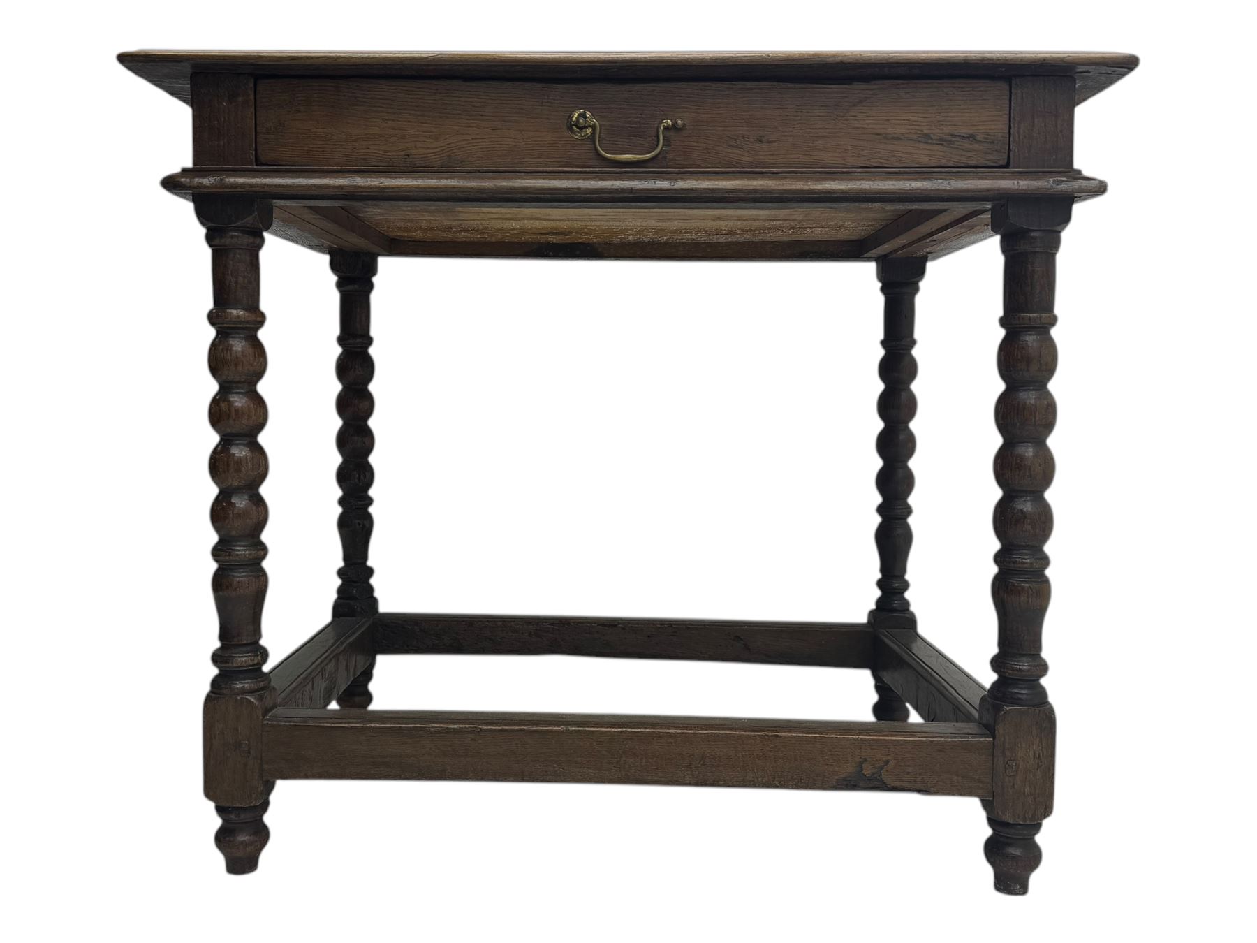 Late Victorian oak side table, rectangular top with moulded edge and frieze drawer with brass handle, raised on turned bulbous supports united by square-section stretchers