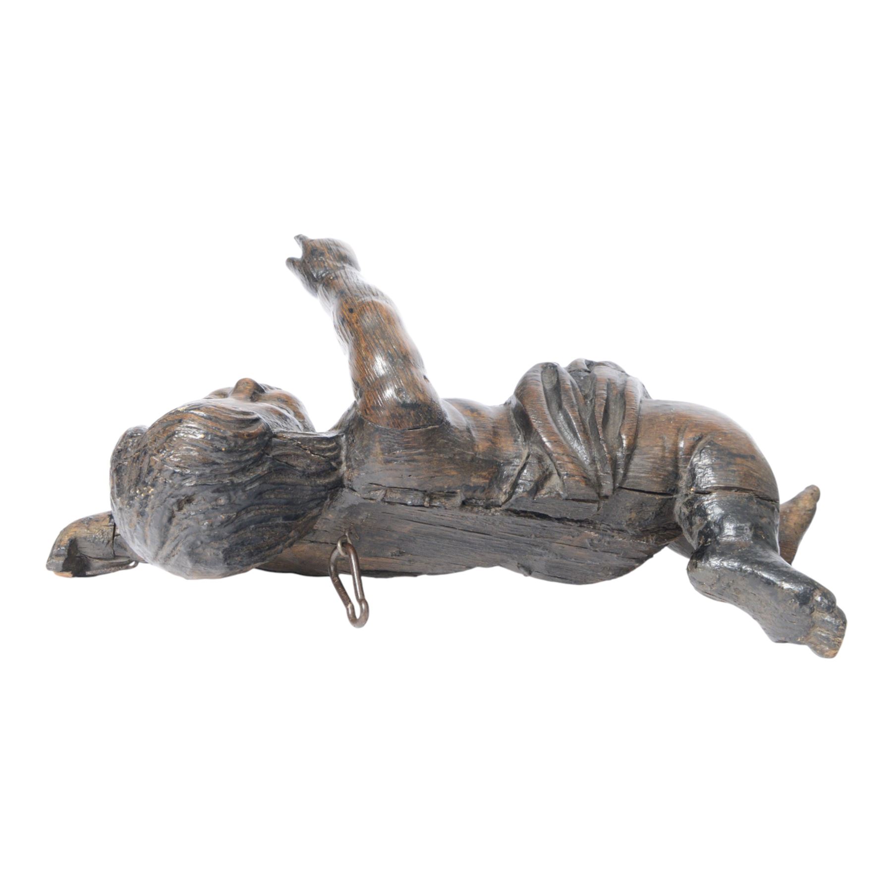 17th century carved figure of a putto, modelled with arms upstretched and head turned, approximately H64cm W23cm D27cm