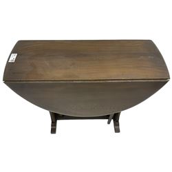 Mid-20th century dark elm drop-leaf table, shaped end supports and double gate-leg action